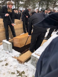 A funeral lowering coffin